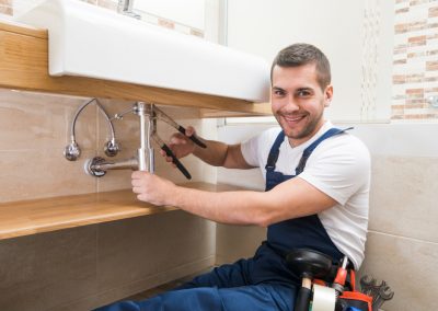 plumber fixing sink